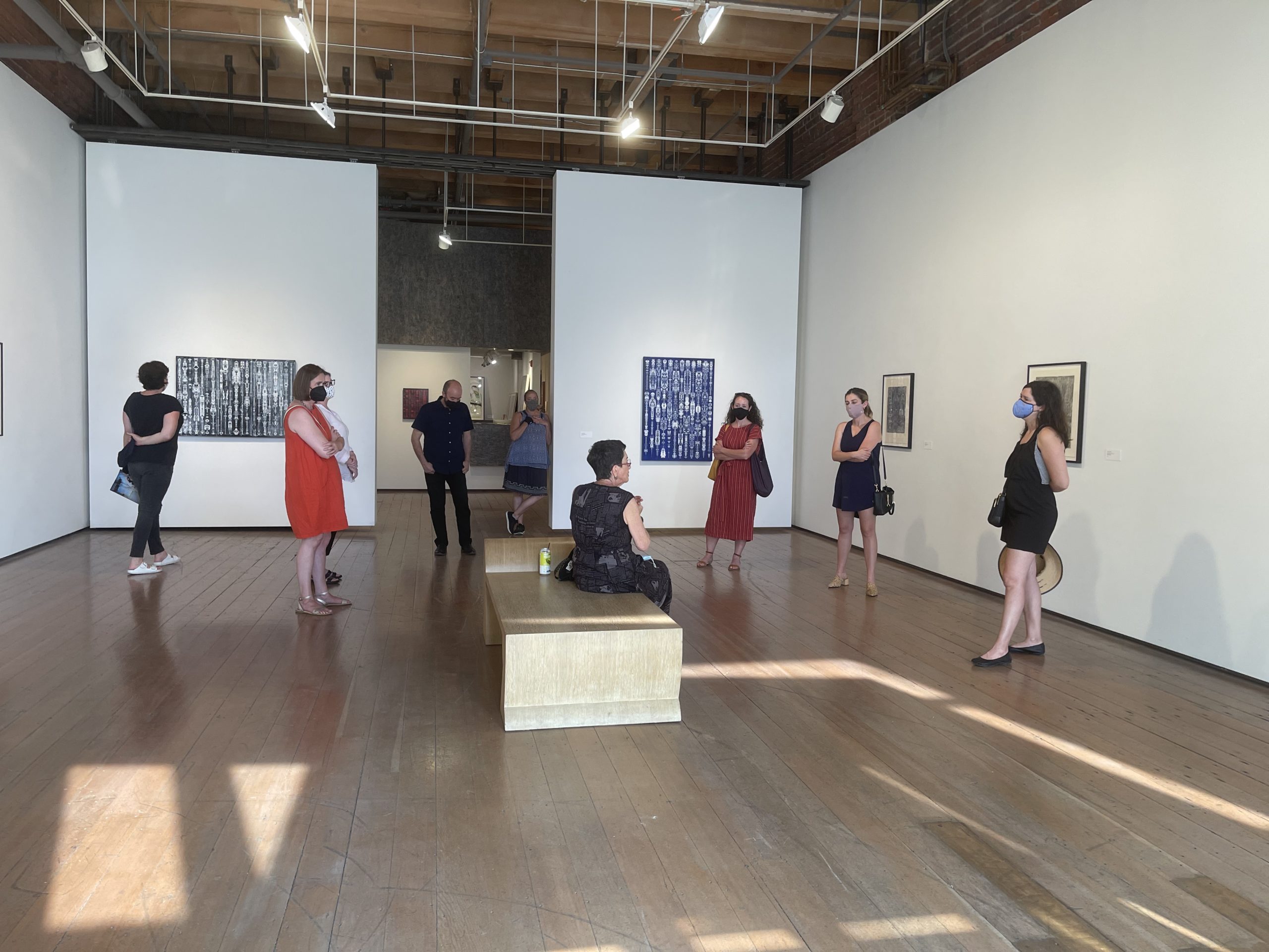 Northwest members socially distanced in a gallery space
