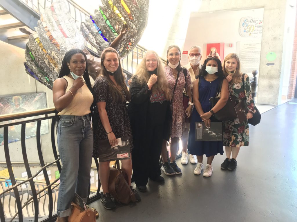 7 women pose for a photo inside the American Visionary Art Museum